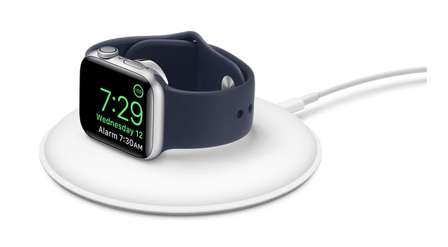 Apple Watch docked on its side to use it as your alarm clock